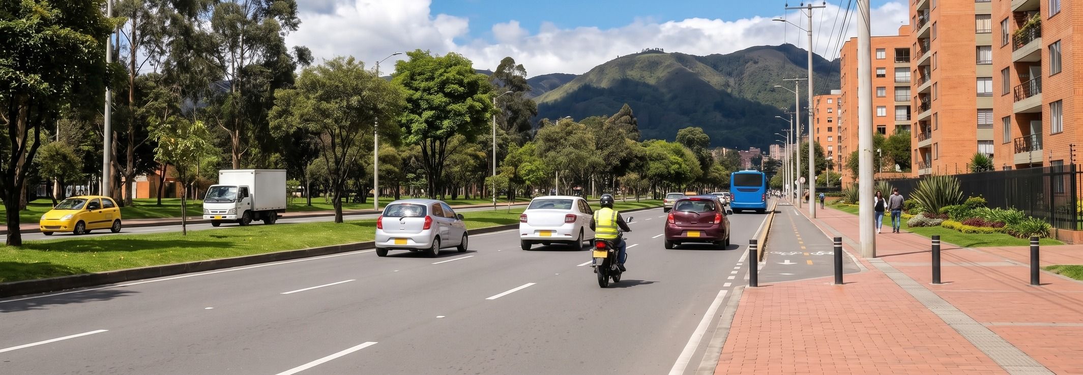 Vista ilustrativa de una avenida de Bogotá con vehículos y los cerros al fondo